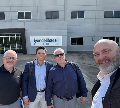 Marty with three colleagues standing outside LyondellBasell building.