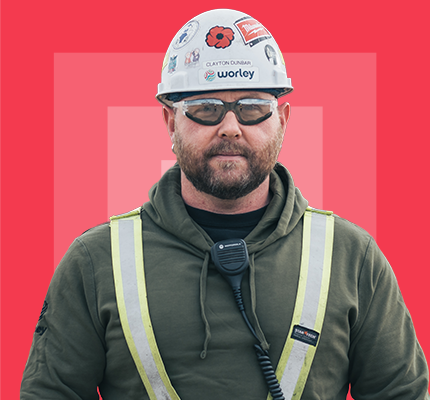 Optravation Energyworker wearing hard hat and safety glasses.