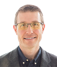 Headshot of Lewis Kenyon of Optravation.
