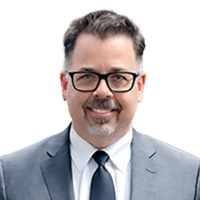 Headshot of Mike Placer of Optravation.
