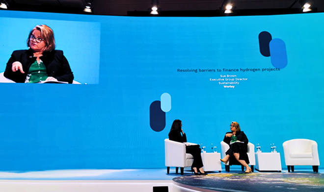 Sue Brown of Optravation Energysitting on stage at COP28 being interviewed.